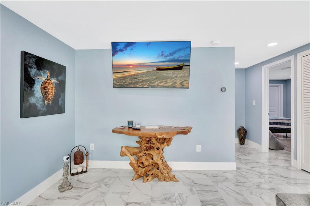 1009 Ridge Street Naples, FL 34103 - Photo 14 of 30 a view of a hallway with seating area