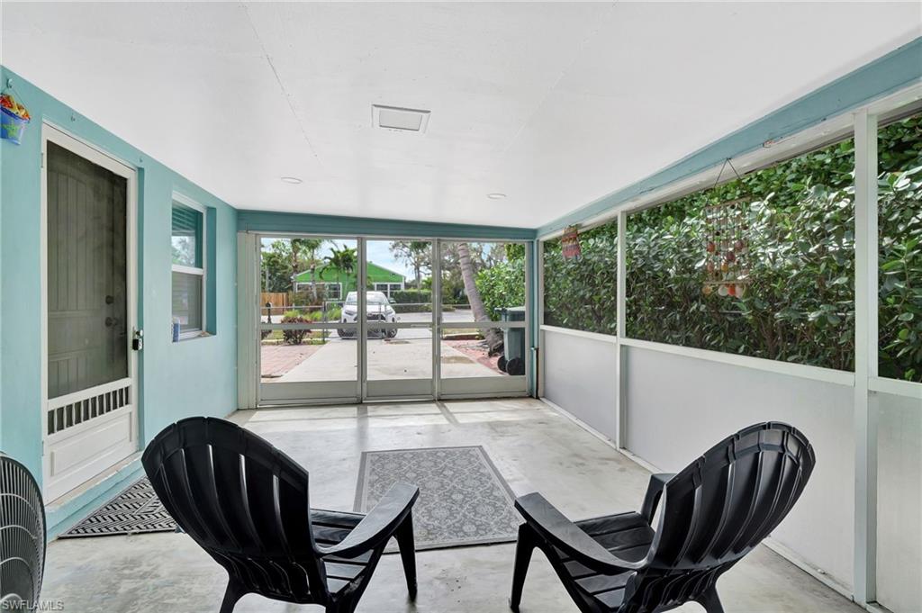 1009 Ridge Street Naples, FL 34103 - Photo 4 of 30 a view of a dining room with furniture wooden floor and balcony