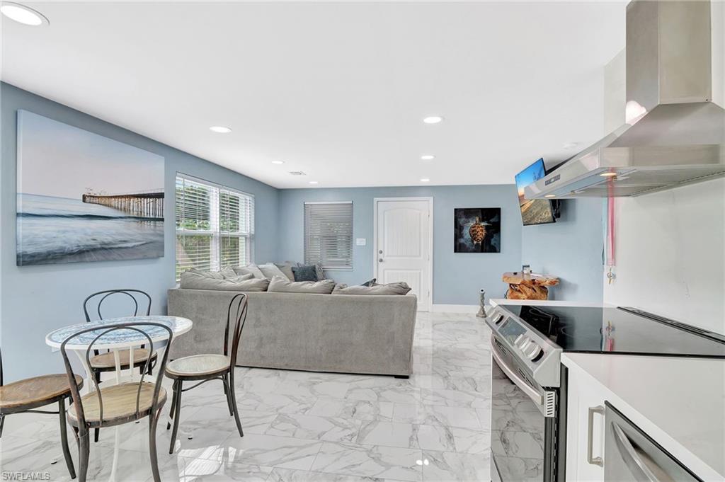1009 Ridge Street Naples, FL 34103 - Photo 8 of 30 a living room with furniture and a table