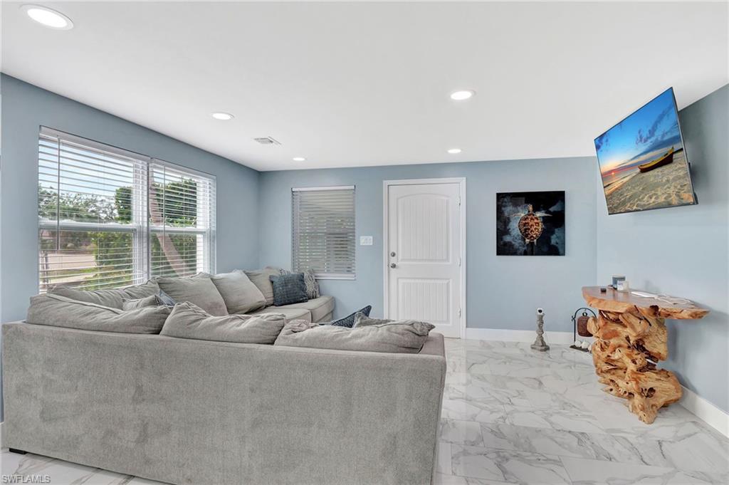1009 Ridge Street Naples, FL 34103 - Photo 9 of 30 a living room with furniture and a large window