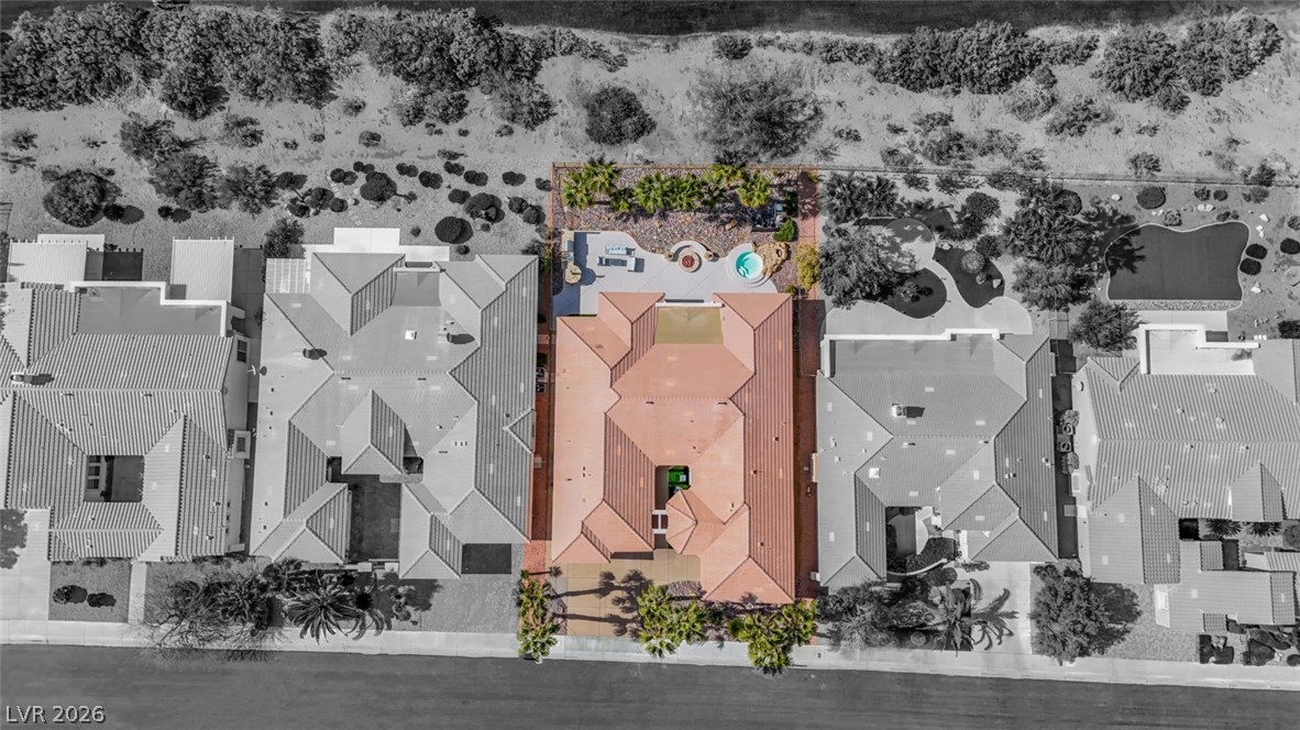 5015 Rivedro Street Las Vegas, NV 89135 - Photo 86 of 91 An aerial perspective reveals a private pool area and lush desert landscaping.