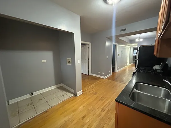 a kitchen with sink and cabinets