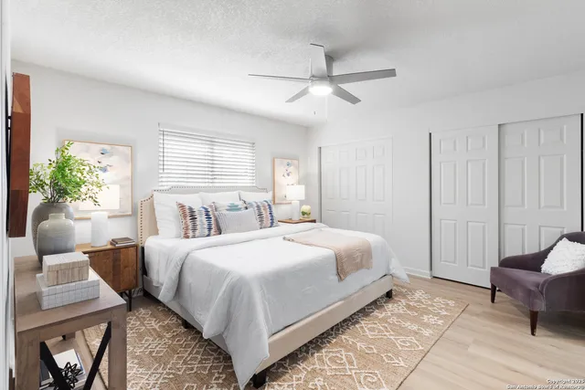 a bedroom with a bed and a couch