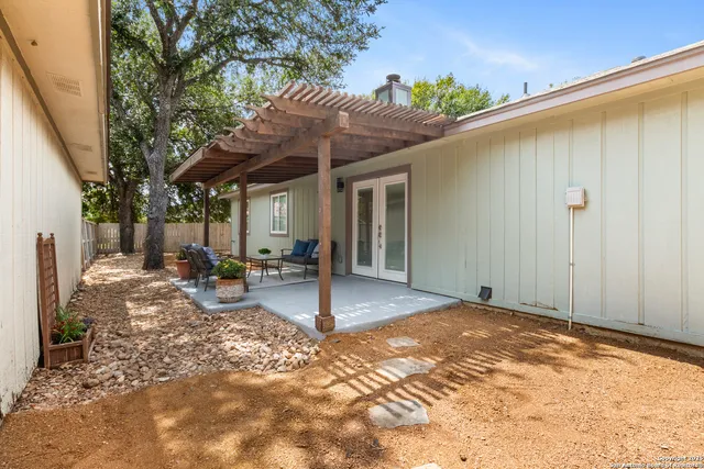 a backyard of a house with seating space