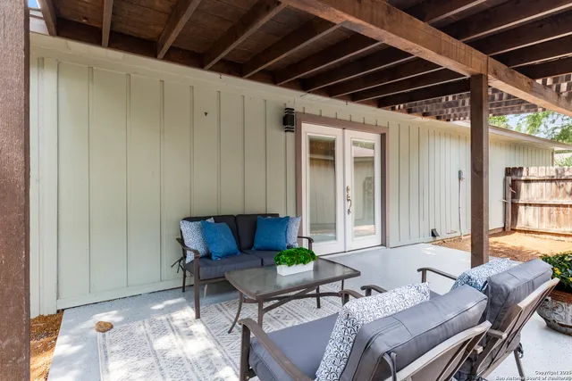 a living room with furniture and a window
