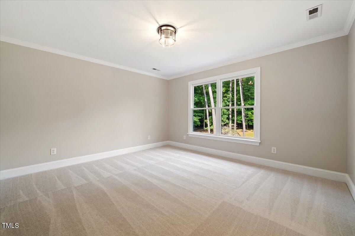 6300 Swallow Cove Lane Raleigh, NC 27614 - Photo 39 of 67 a view of an empty room with a window