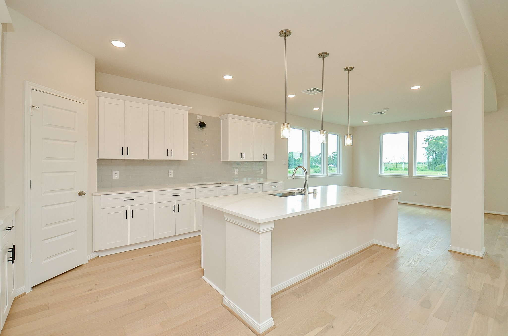 20637 Dynamic Court Humble, TX 77338 - Photo 11 of 32 a large white kitchen with a large window