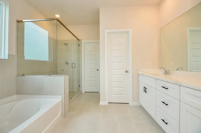 a bathroom with a double vanity sink and a mirror
