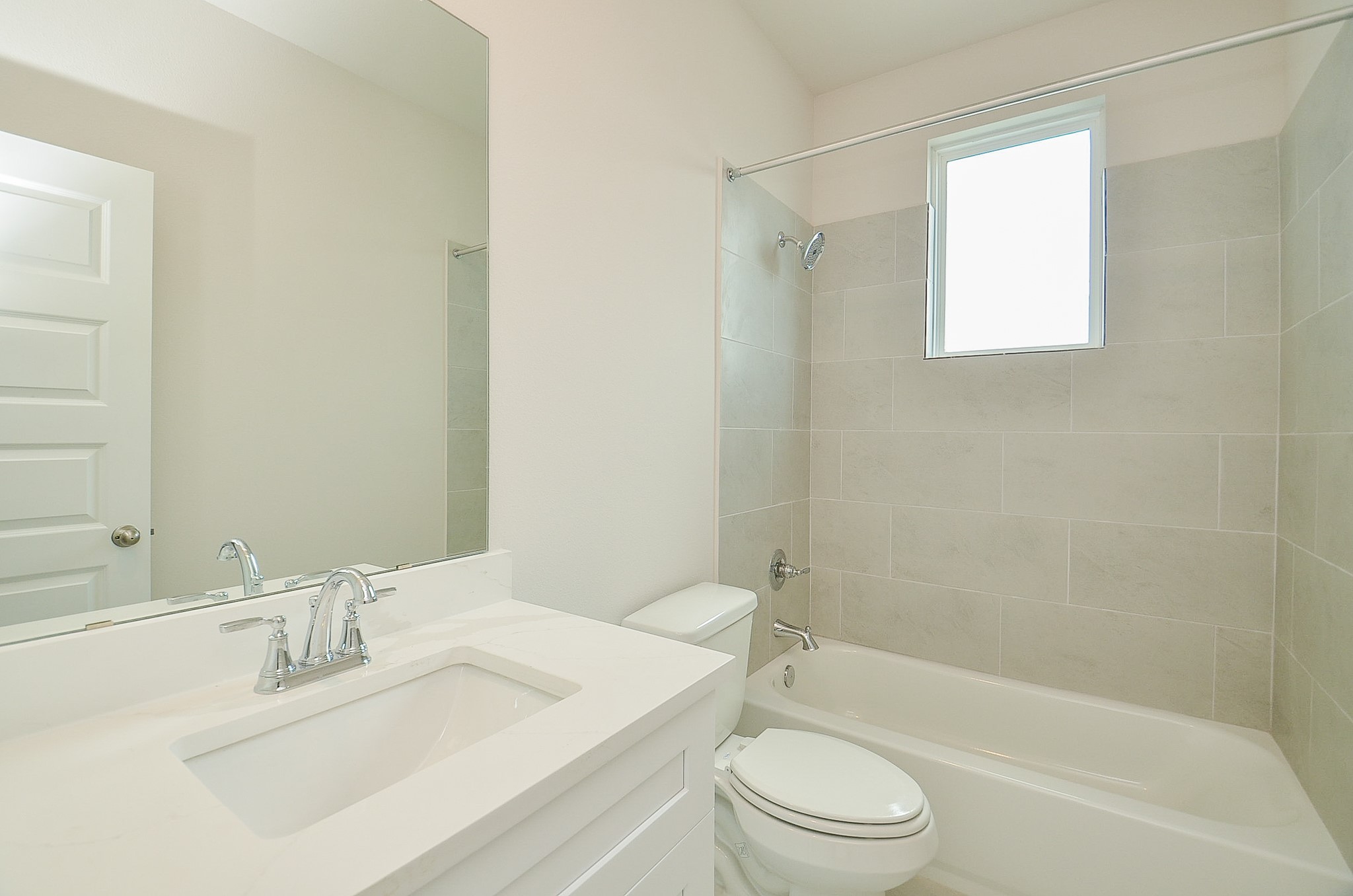 20637 Dynamic Court Humble, TX 77338 - Photo 25 of 32 a bathroom with a bathtub shower sink vanity mirror and toilet