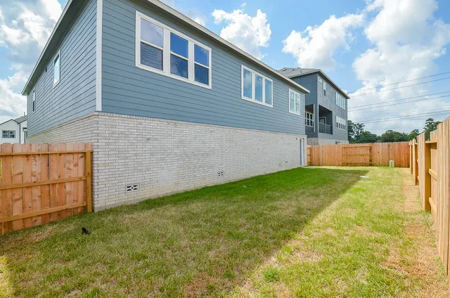 a backyard of a house with lots of green space