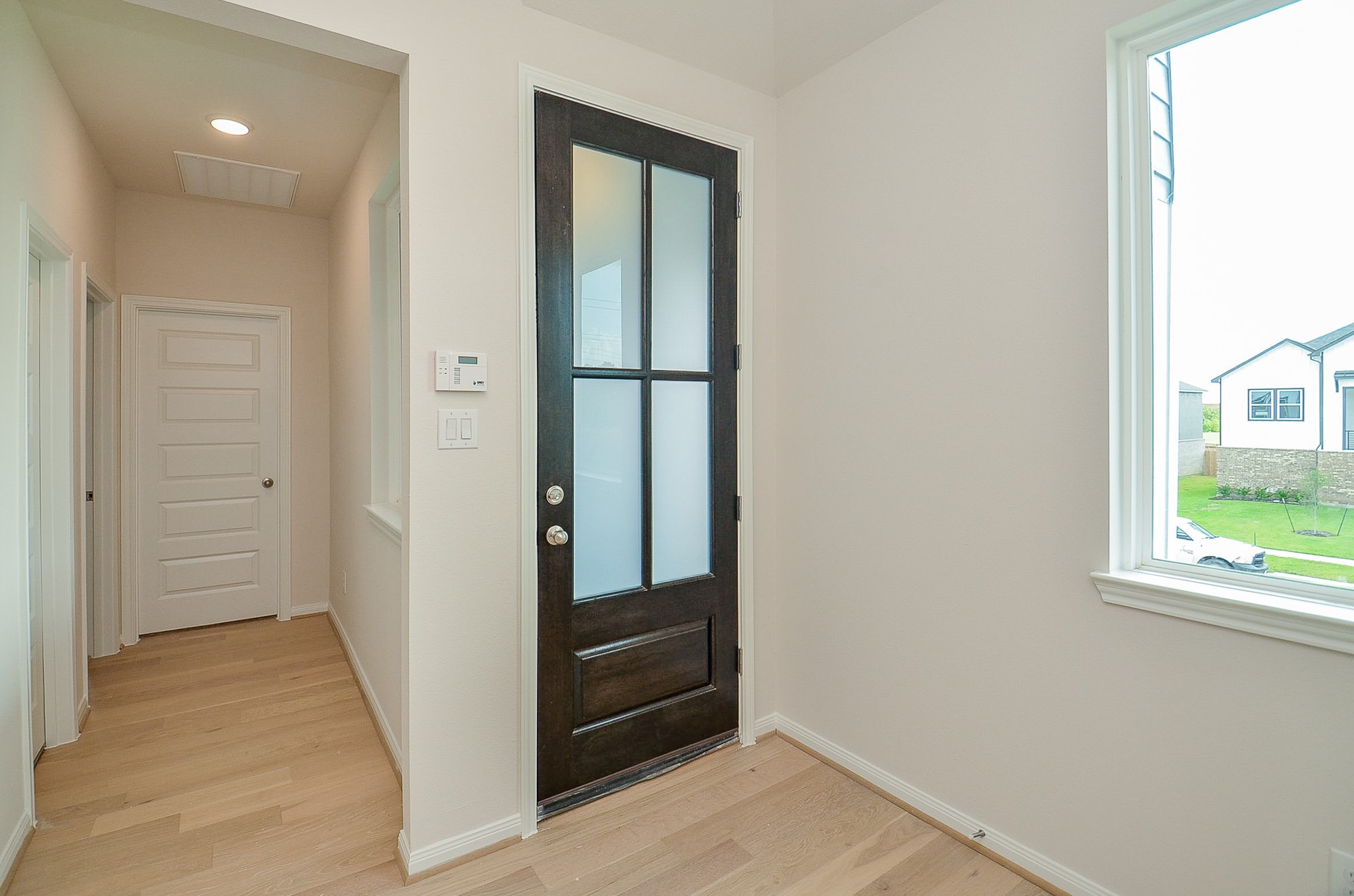20637 Dynamic Court Humble, TX 77338 - Photo 5 of 32 an entryway view with wooden floor and cabinet