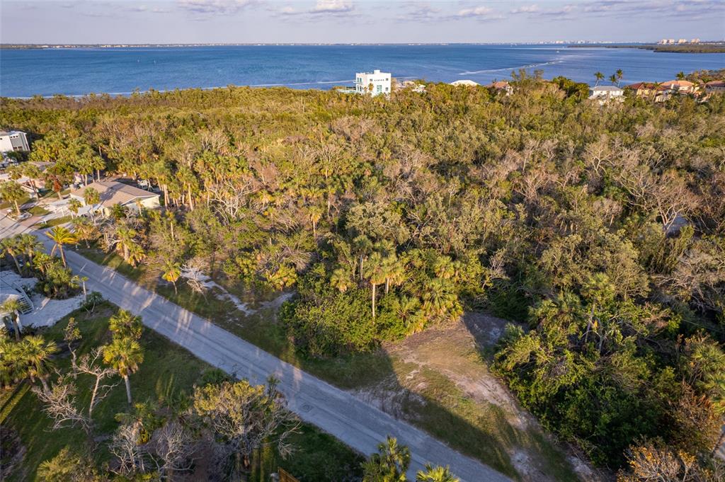 560 Gulf Bay Road Longboat Key, FL 34228 - Photo 14 of 38 a view of an outdoor space and a lake view