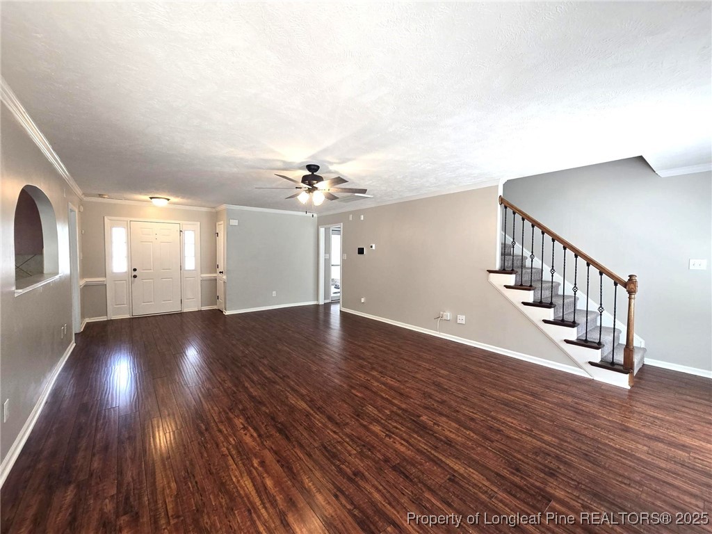 175 Briar Haven Court Raeford, NC 28376 - Photo 11 of 44 a view of an empty room with wooden floor and staircase