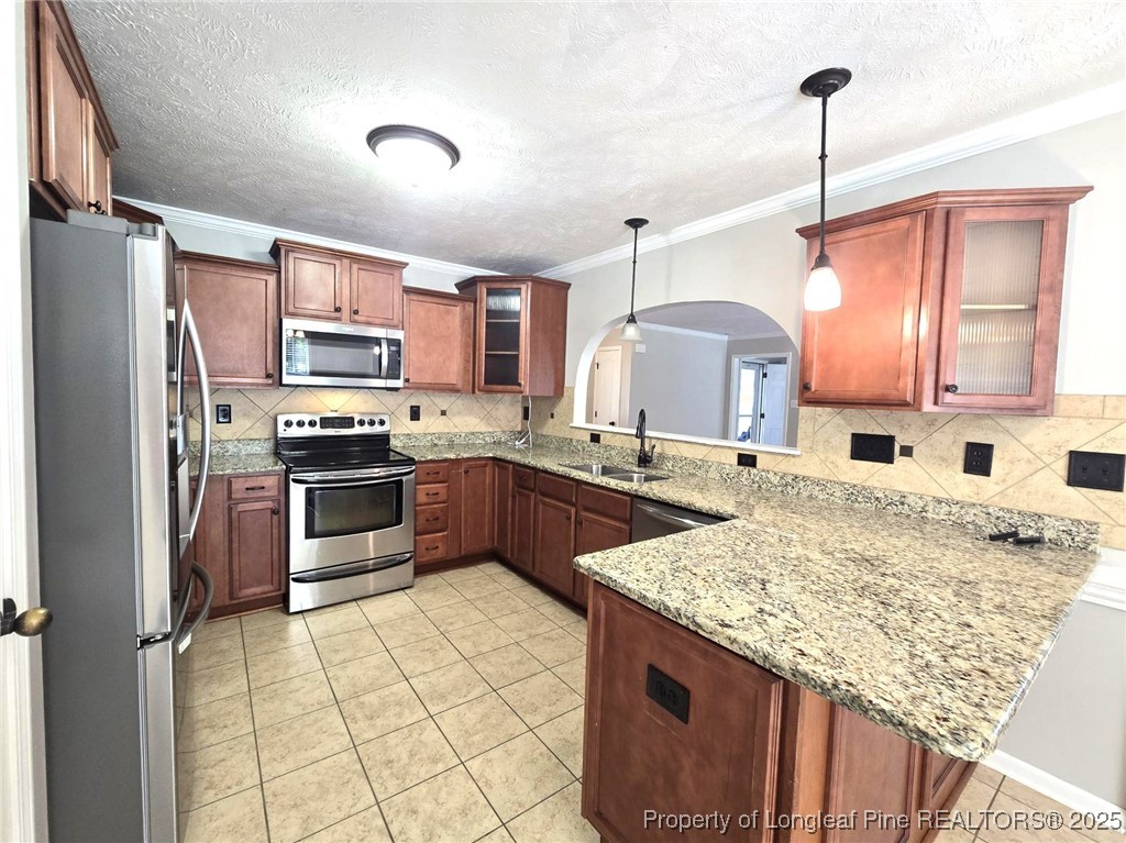 175 Briar Haven Court Raeford, NC 28376 - Photo 13 of 44 a kitchen with stainless steel appliances granite countertop a sink refrigerator and cabinets