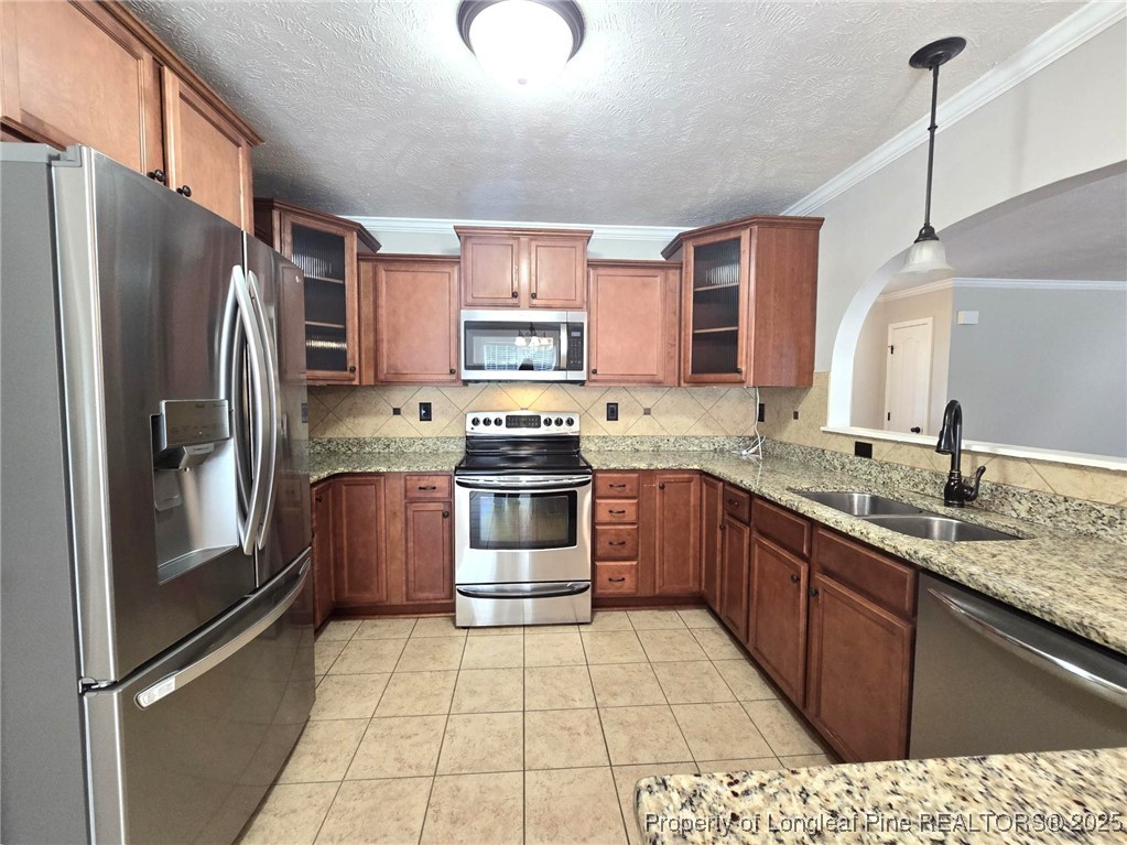 175 Briar Haven Court Raeford, NC 28376 - Photo 15 of 44 a kitchen with stainless steel appliances granite countertop a refrigerator and a sink