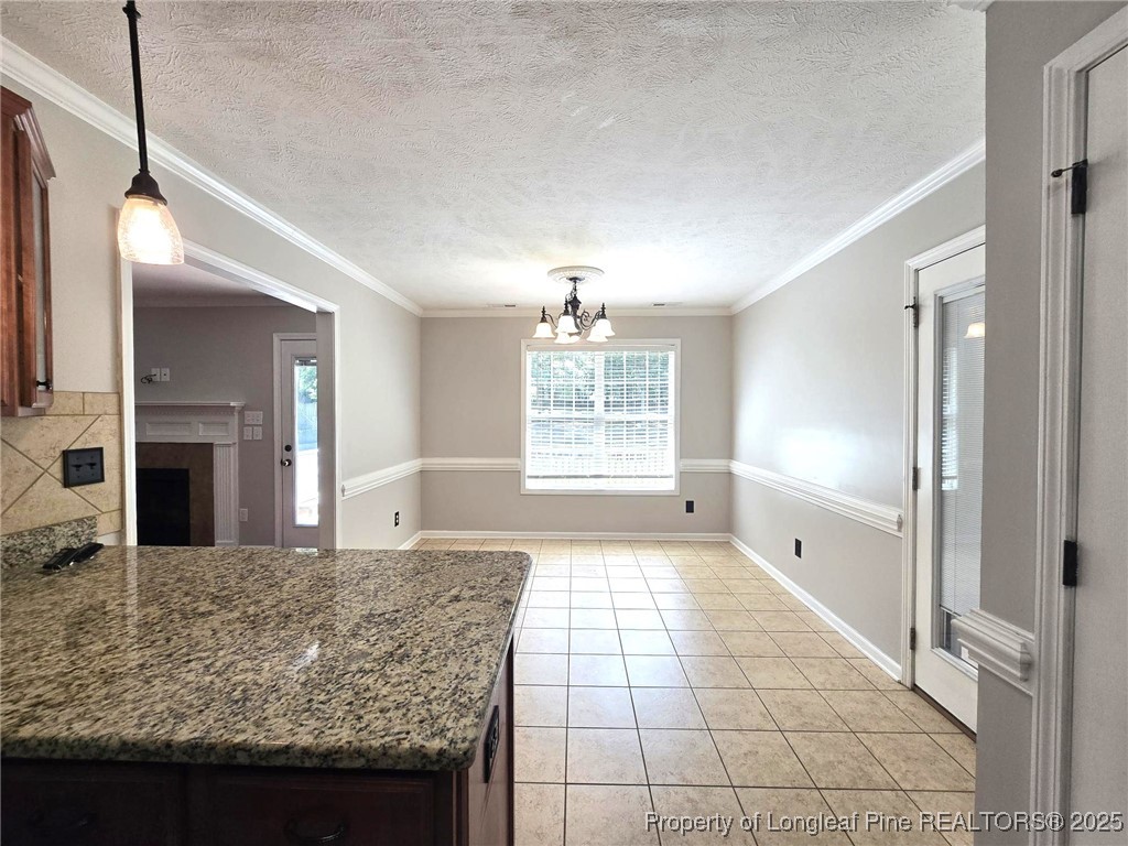 175 Briar Haven Court Raeford, NC 28376 - Photo 16 of 44 a view of a kitchen with granite countertop a sink and dishwasher with wooden floor