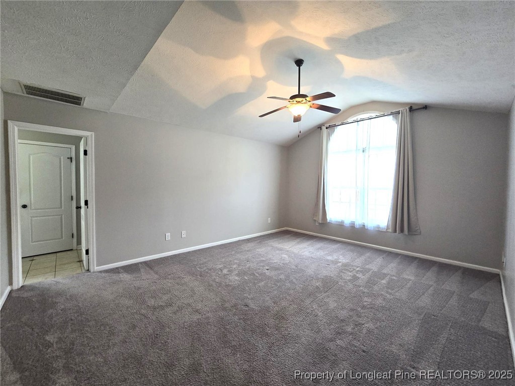 175 Briar Haven Court Raeford, NC 28376 - Photo 18 of 44 an empty room with chandelier fan and windows