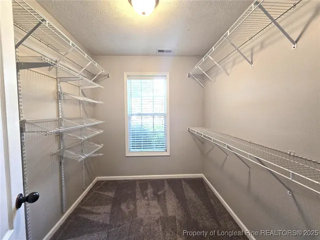 a view of an empty walk in closet