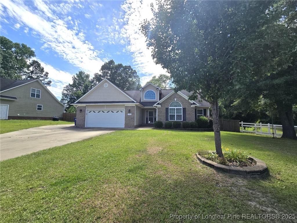 175 Briar Haven Court Raeford, NC 28376 - Photo 3 of 44 a front view of a house with garden