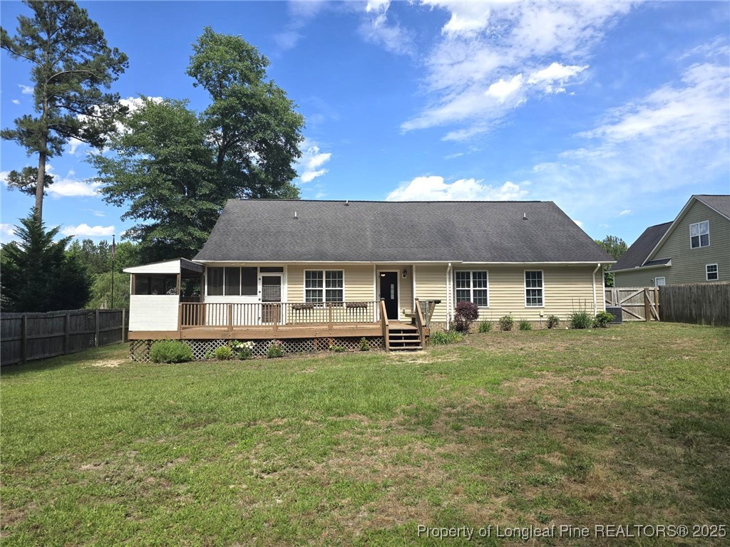 175 Briar Haven Court Raeford, NC 28376 - Photo 34 of 44 a front view of a house with a garden and trees