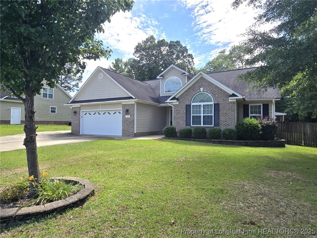 175 Briar Haven Court Raeford, NC 28376 - Photo 4 of 44 a front view of a house with a yard