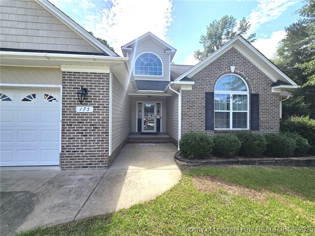 175 Briar Haven Court Raeford, NC 28376 - Photo 6 of 44 a front view of a house with garden