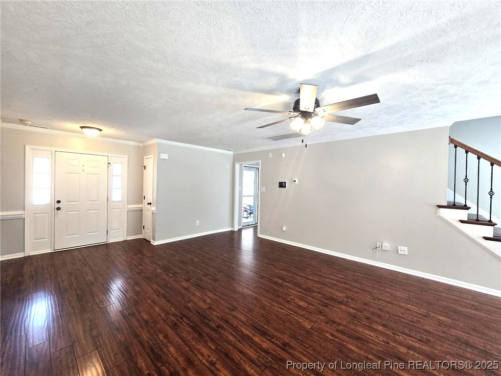 175 Briar Haven Court Raeford, NC 28376 - Photo 9 of 44 a view of an empty room with wooden floor and a ceiling fan