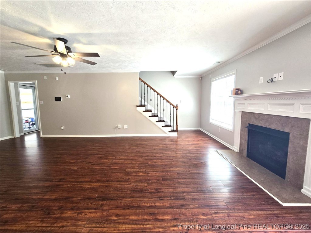 175 Briar Haven Court Raeford, NC 28376 - Photo 10 of 44 a view of an empty room with wooden floor and a fireplace