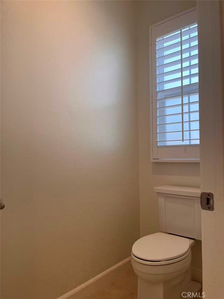 119 Alumroot Irvine, CA 92620 - Photo 18 of 35 a white toilet sitting next to a window