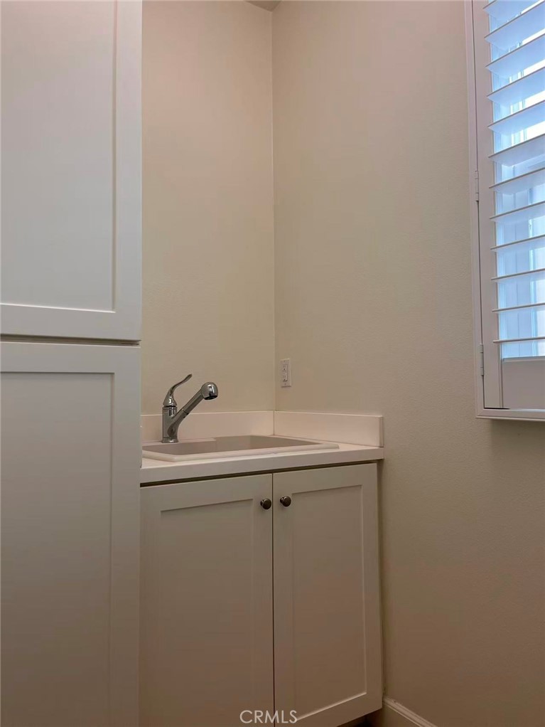 119 Alumroot Irvine, CA 92620 - Photo 23 of 35 a bathroom with a sink and vanity