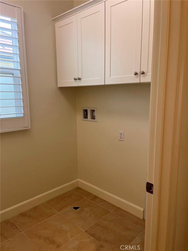 119 Alumroot Irvine, CA 92620 - Photo 24 of 35 a view of door with cabinets