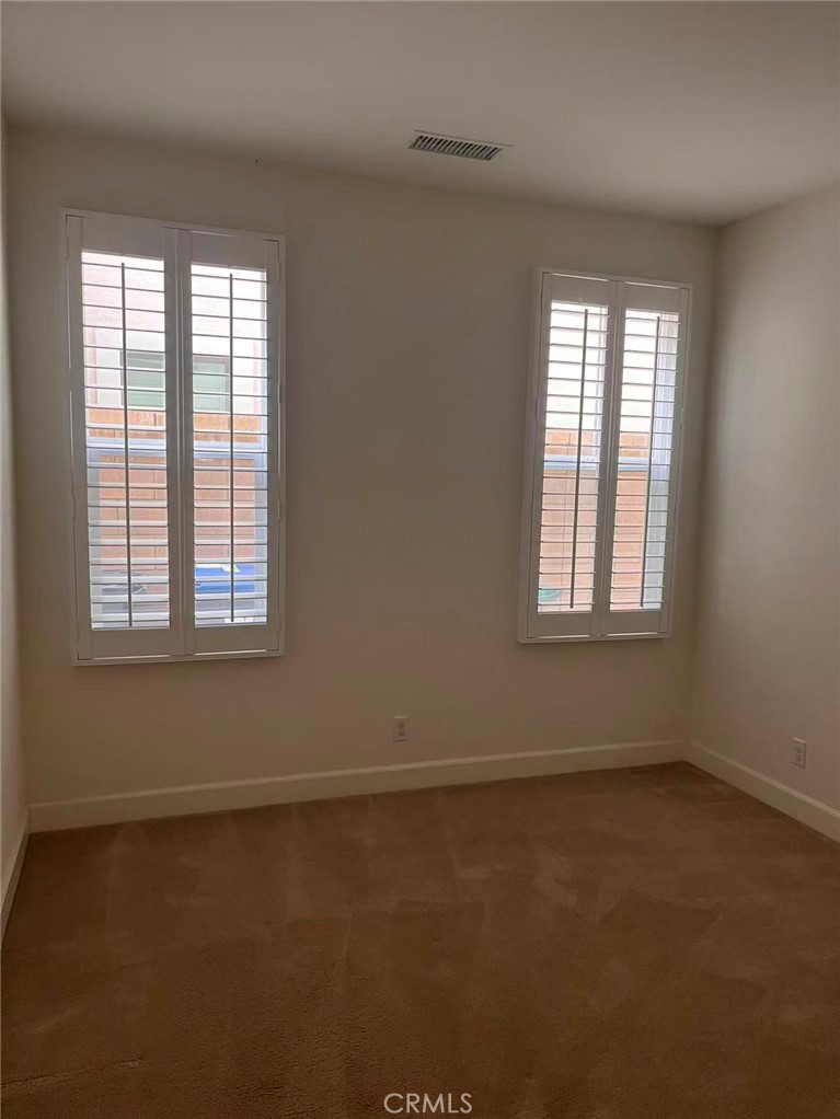 119 Alumroot Irvine, CA 92620 - Photo 25 of 35 an empty room with a window