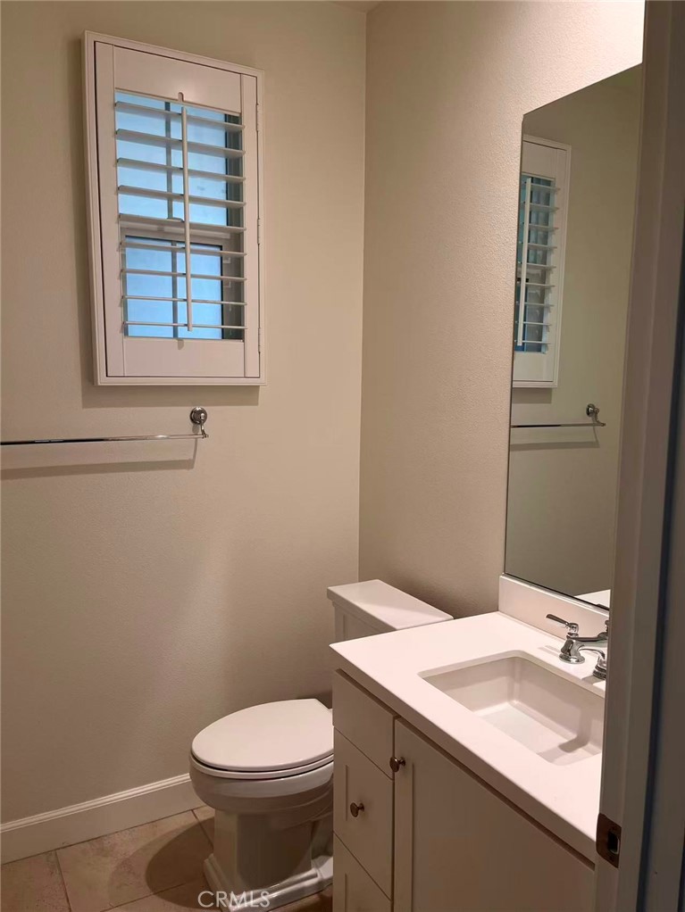 119 Alumroot Irvine, CA 92620 - Photo 26 of 35 a bathroom with a sink and a toilet