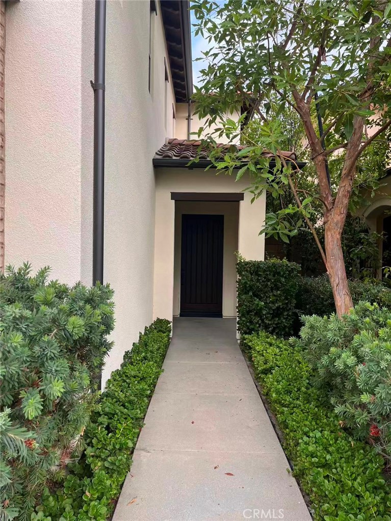 119 Alumroot Irvine, CA 92620 - Photo 5 of 35 a front view of a house with a yard