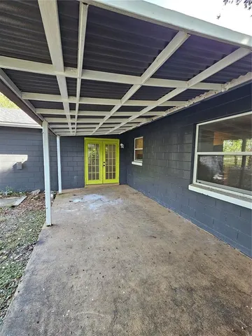 a view of an empty room with a windows