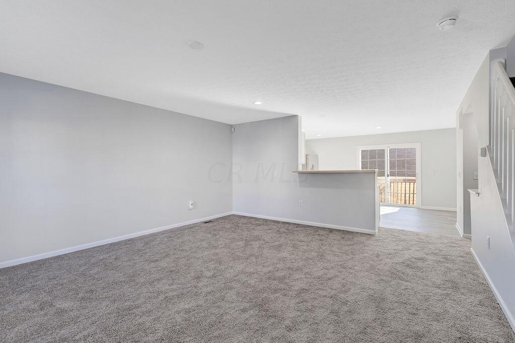 6345 Needletail Road, Unit 24634 Columbus, OH 43230 - Photo 3 of 58 • New gray carpet ~ 2021 • Gray painted walls • Ceiling light • Can lighting in Dining Area • 2” blinds