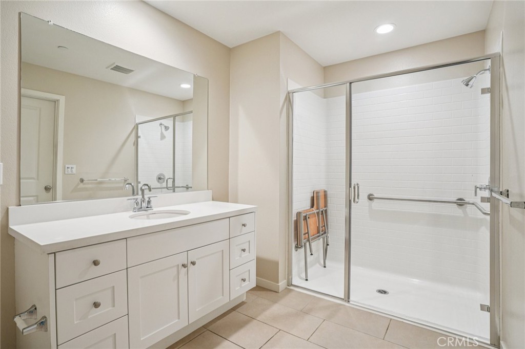 143 Frame Irvine, CA 92618 - Photo 22 of 41 a bathroom with a double vanity sink mirror and shower