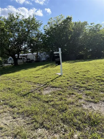a view of a swimming pool with a yard