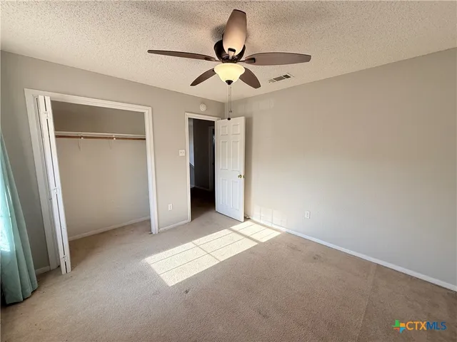 an empty room with fan