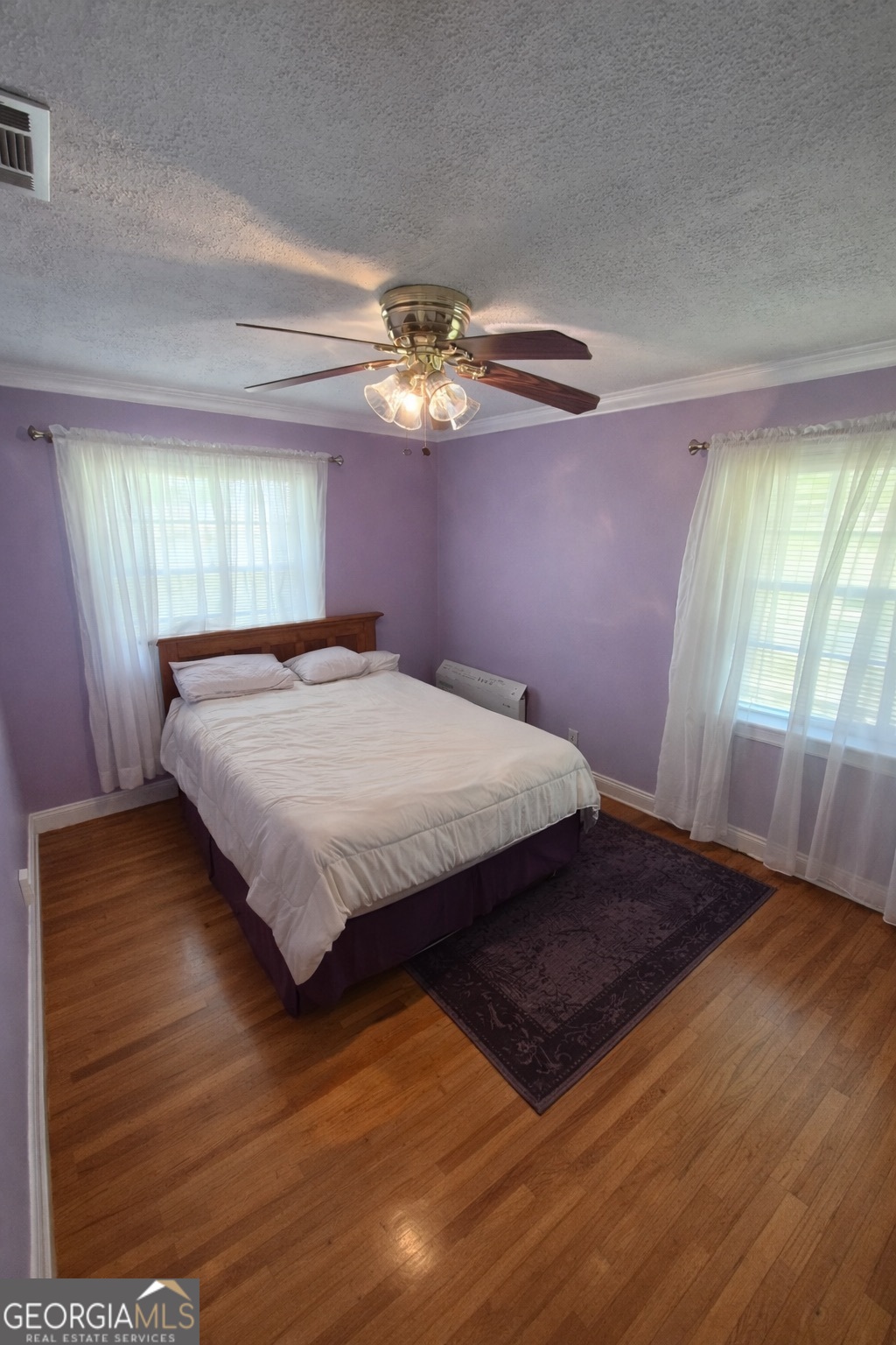 13 Marshall Street Butler, GA 31006 - Photo 15 of 27 a bedroom with a bed and window