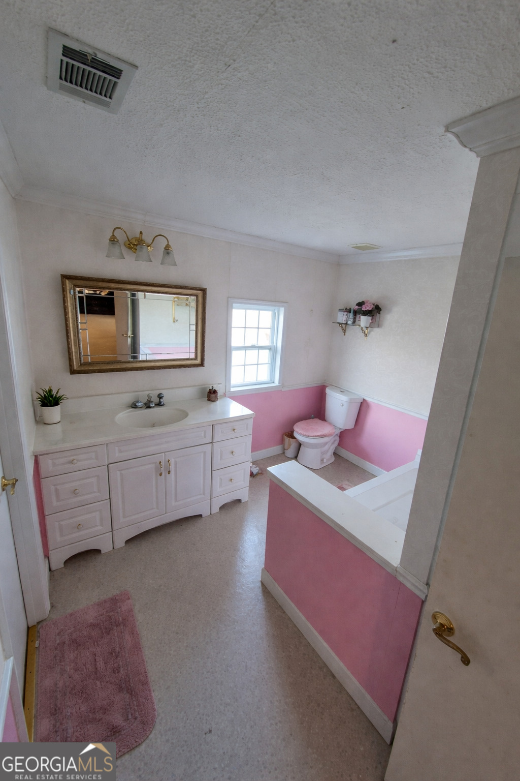 13 Marshall Street Butler, GA 31006 - Photo 25 of 27 a bedroom with bed and window