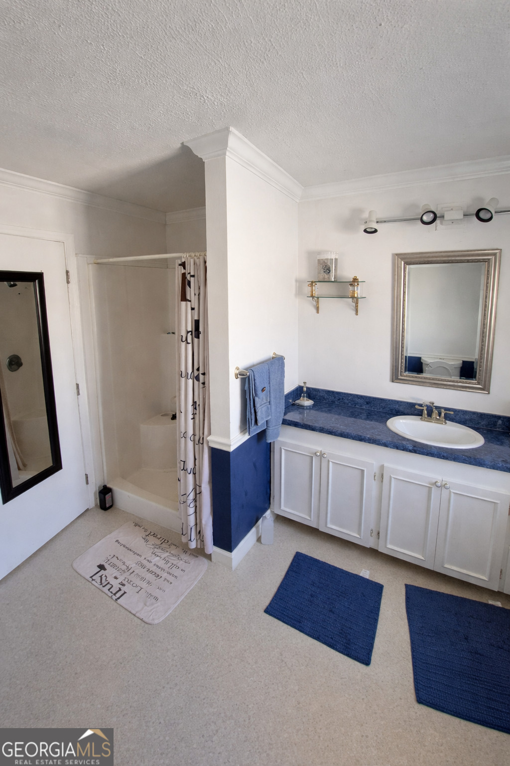 13 Marshall Street Butler, GA 31006 - Photo 26 of 27 a spacious bathroom with a double vanity sink and a mirror