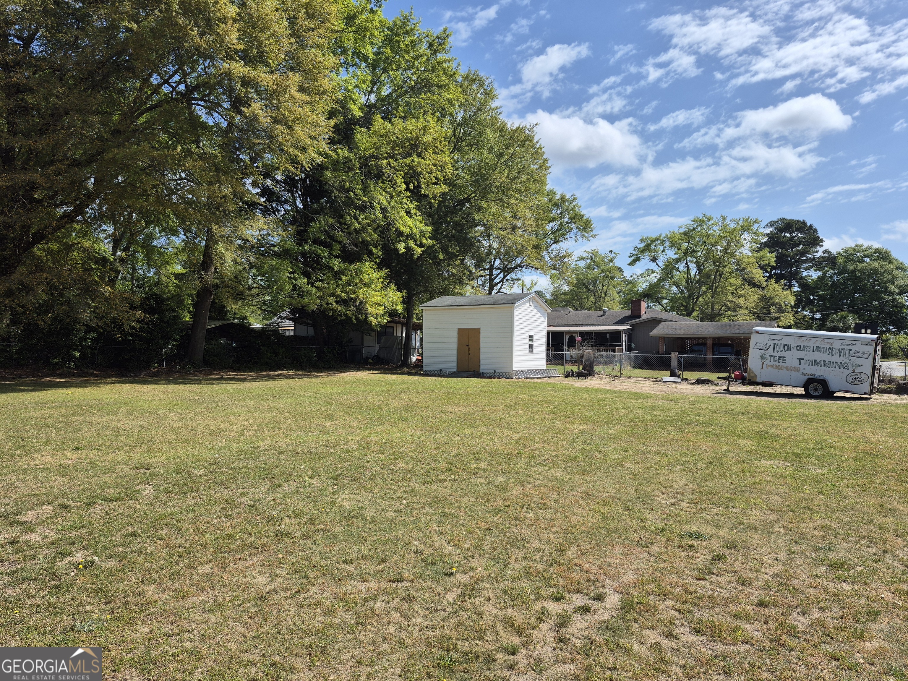 13 Marshall Street Butler, GA 31006 - Photo 5 of 27 a front view of house with yard and trees in the background