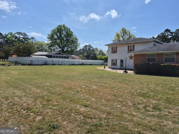 a house view with a garden space
