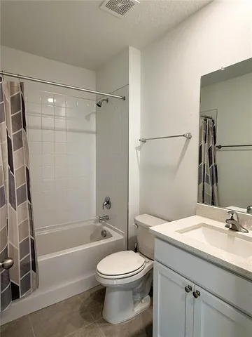a bathroom with a toilet a sink and a bathtub
