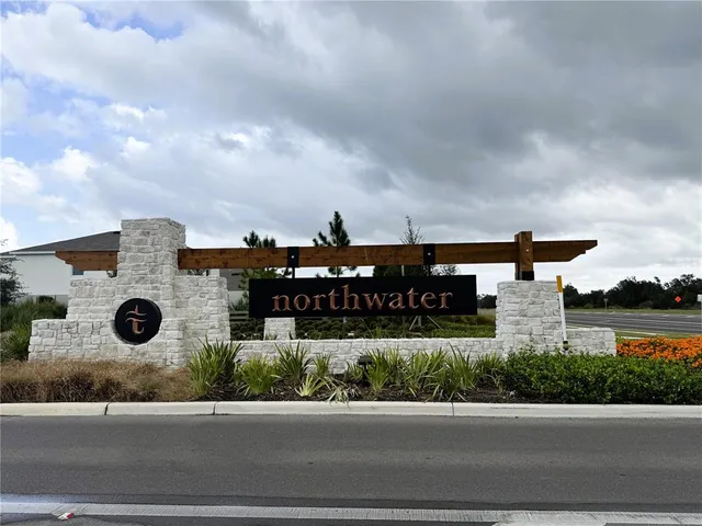 a view of a street with a building in the background