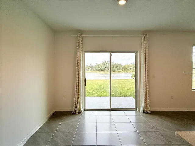 a view of an empty room and window
