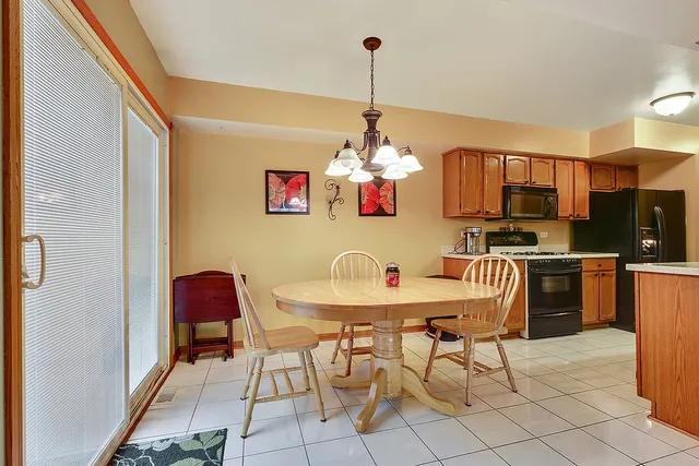 a table and chairs in a kitchen
