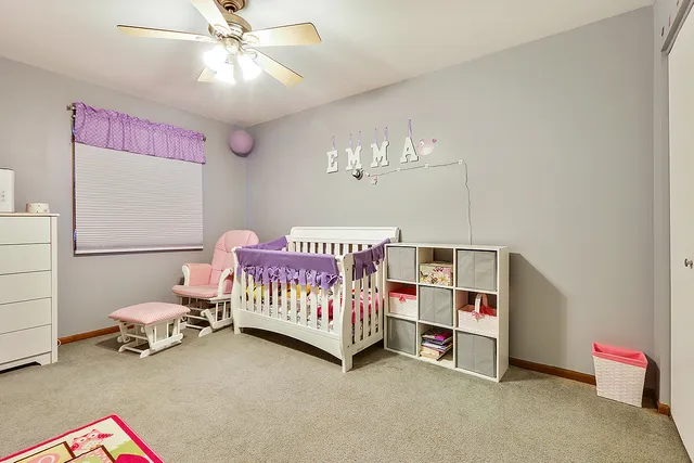 a bedroom with furniture and a chandelier