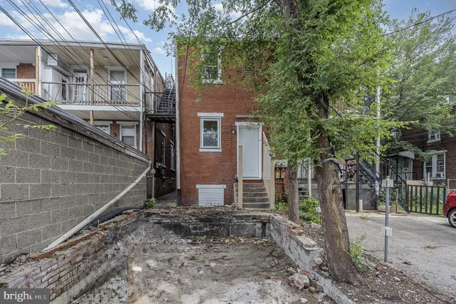 a backyard of a house with lots of trees